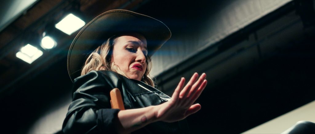 Face of an actress who's on a theatre play looking at her hand